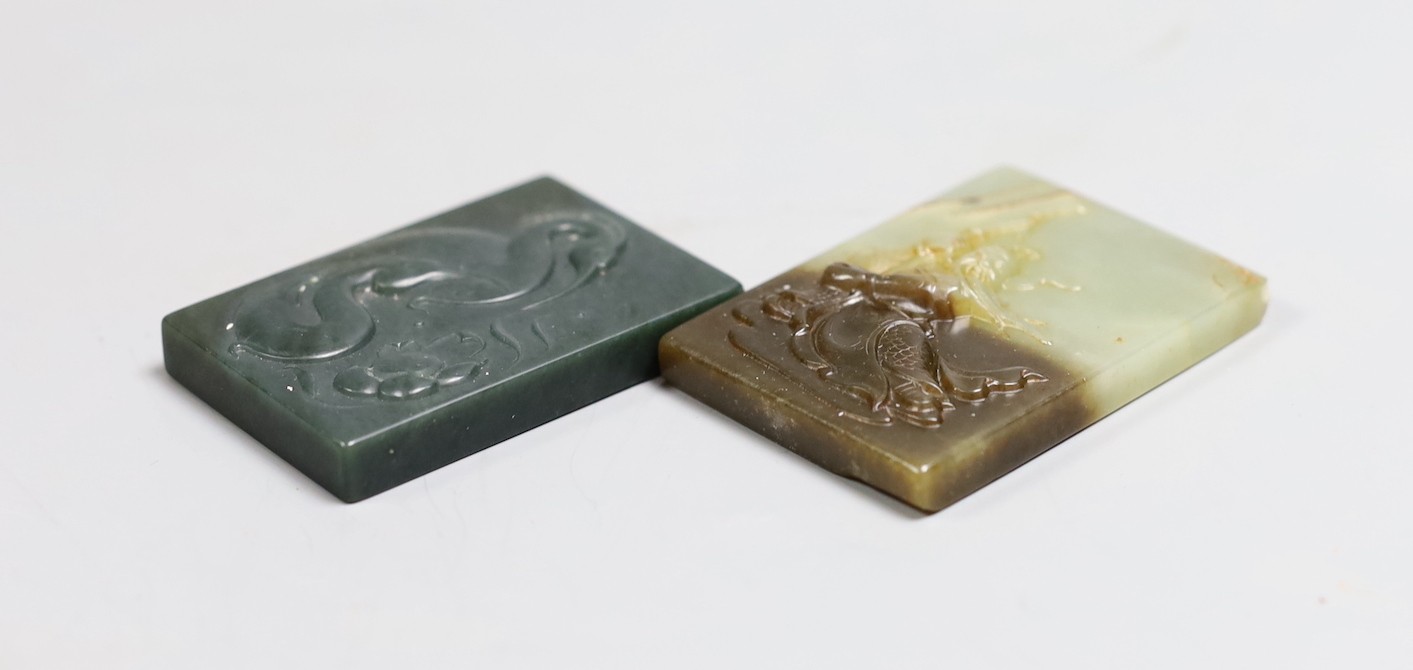 A Chinese russet and pale celadon jade plaque, 6.2cm and another green jade plaque